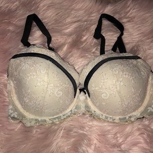 white lace bra with black accents and bow